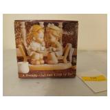 "A friendly chat and a cup of tea" by Enesco,