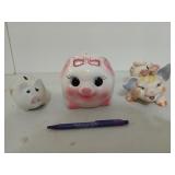 Three cute little piggy banks, the biggest is