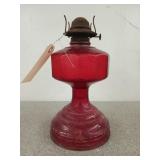Red glass hurricane lamp, paint is beginning to