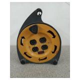 Extension cord reel with four plugs