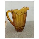 8 inch amber glass "moon and stars" pitcher