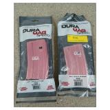 Two pink aluminum, 20 round, AR-15 magazines