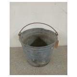 Galvanized bucket with a few dings, 9 in