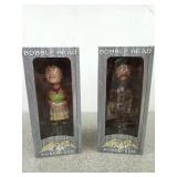 Two duck Commander bobbleheads, Kay and Jase