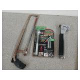 A 12-in hacksaw, a new in package Gator Grip