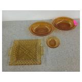 3 amber glass bowls, two are 10 by 7 inches, and