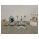 Four carousel horse figurines, three are music