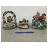 Three teddy bear figurines, two are music boxes,