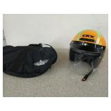 CKX orange and green motorcycle helmet with the
