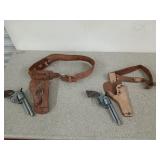 Two cap guns and two child