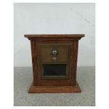 Wooden bank with an old PO box lid from