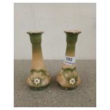 Pair of green and cream colored candlestick