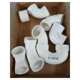 Flat of mostly PVC elbows, 1.5 in