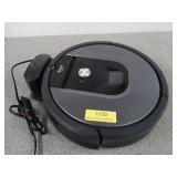 iRobot Roomba vacuum cleaner, with dock, powers on