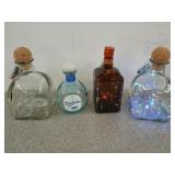 Three fairy light liquor bottles, one needs new