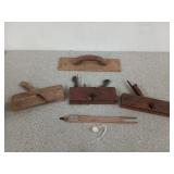 Old wooden tools, including a 14 inch trowel and
