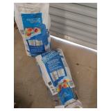 Two 50 lb bags of tile mortar, both bags have