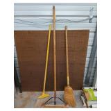A 48x47-in pegboard and three brooms