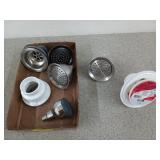 Assorted shower heads and shower drains