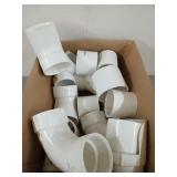 Assorted PVC pipe fittings and elbows, three to