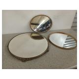 Three old mirrors, two hang on walls, 14 in and