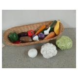 Woven basket filled with ceramic vegetables
