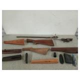 Assortment of gun parts, mostly stocks, most