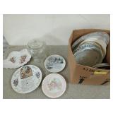 Box filled with fancy plates and a 9 inch glass