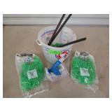 Assorted tile spacers, etc, in a plastic bucket