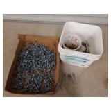 Flat of mostly 2 in screws, and a white bucket