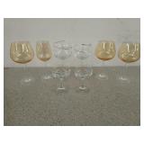 Eight fancy wine glasses, two are groom and bride