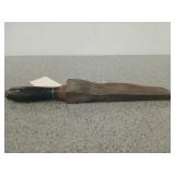 14 in wooden handled, well worn whetstone