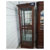 Wood and glass curio cabinet, lighted, has