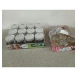 Box filled with assorted Mason jars, some are