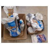 Two cardboard boxes filled with ceramic tile