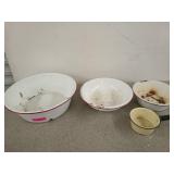 Three white enamel bowls and a yellow enamel