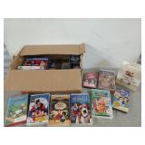 Box filled with VHS tapes, many are new in