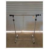 Portable clothes rack, 45 by 40 in, on rollers