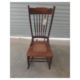 Low wooden rocker with rattan seat, 37x17x31 in
