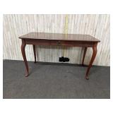 vintage wooden table with cabriole legs