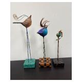 Hand painted bird sculptures