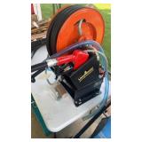 Diesel fuel transfer pump with hose reel and 49ft
