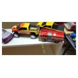 assortment of toy cars and trucks
