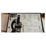 Microscope, slides in a case