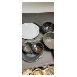 black enamelware pans, plates cups
