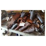 SEVERAL GUN HOLSTERS AND BELTS