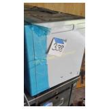 NEW MICROWAVE WITH A DENT IN THE BACK