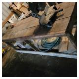 Wood Bench and Garden Hose