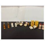 Collection of Ceramic and Wood Salt and Pepper...