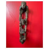 Hanging Wooden Art Featuring Stacked Figures